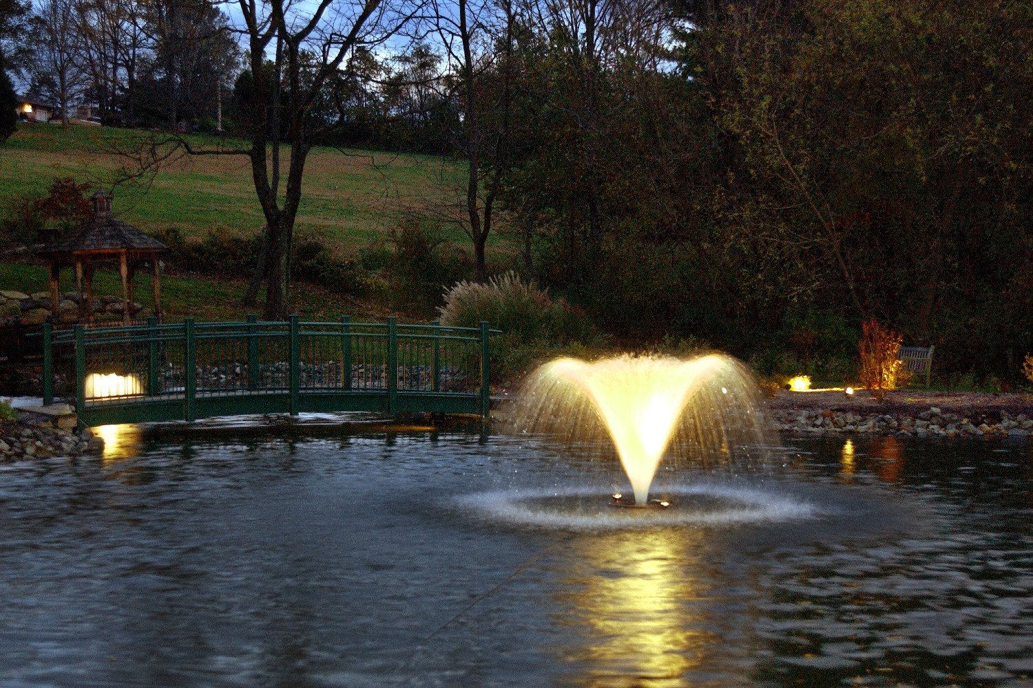 One of Otterbine's Aerating Fountains in a beautiful park at night